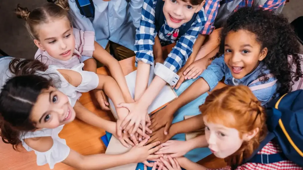 Children joining hands