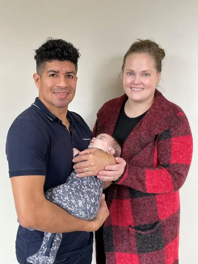 Abner and Kayla Aguilar with their child