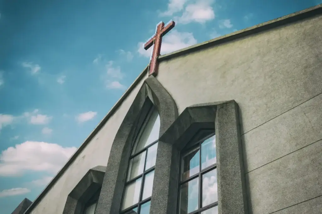 Church steeple featuring a light-up cross