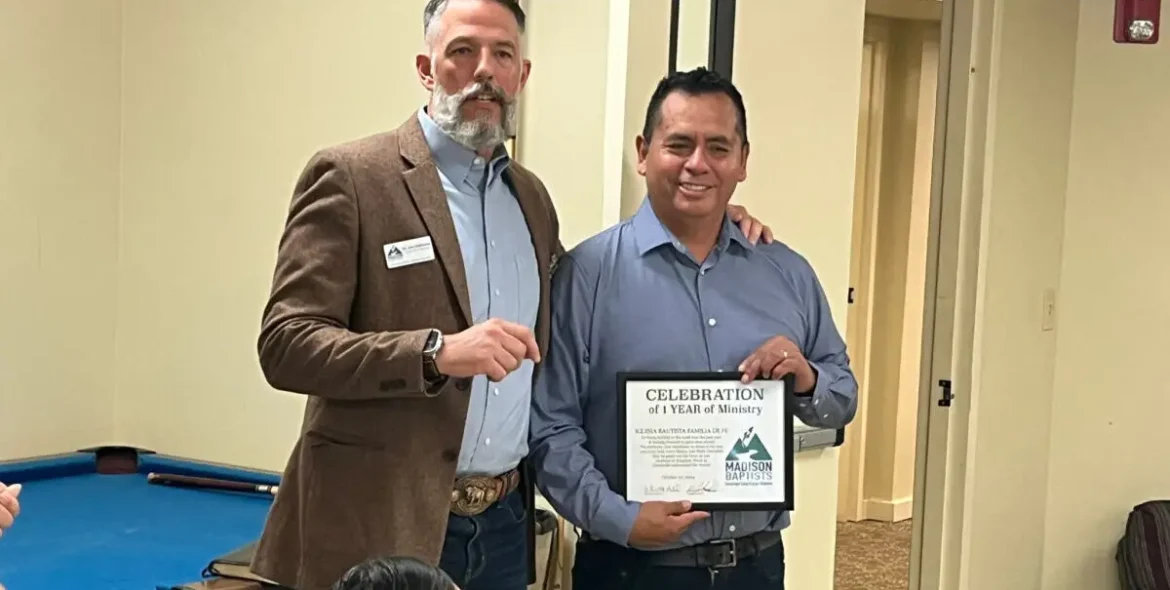 Jon Hathcock presents Pastor Humberto Medina with a certificate celebrating Iglesia Bautista Familia de Fe’s first year of ministry.